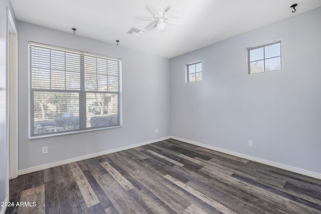 unfurnished room featuring dark hardwood / wood-style floors and ceiling fan