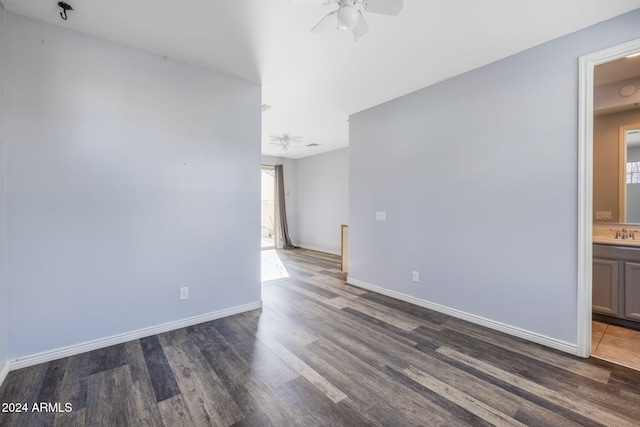 9645 E Theia Dr, Mesa, AZ 85212 - empty room featuring a ceiling fan, dark wood finished floors, and a sink