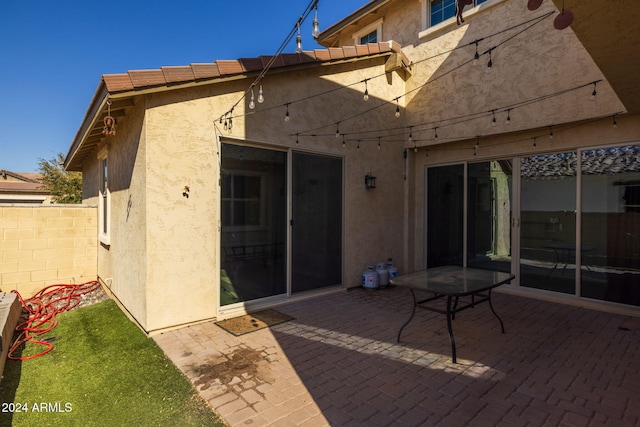 rear view of house featuring a patio