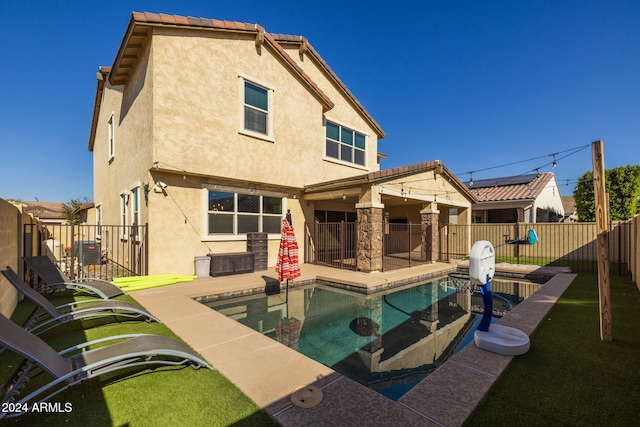 9645 E Theia Dr, Mesa, AZ 85212 - back of property featuring stucco siding, a fenced backyard, central AC, and a patio