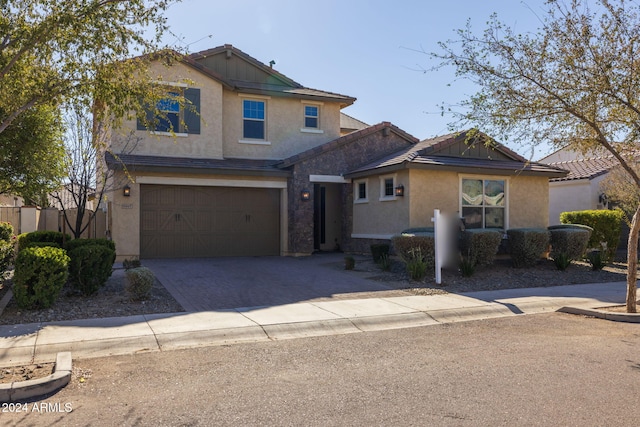 9645 E Theia Dr, Mesa, AZ 85212 - view of front of home featuring stucco siding, an attached garage, and driveway