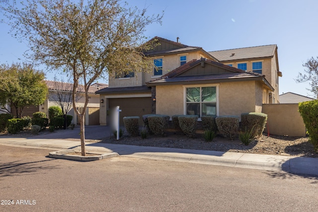 view of front of property with a garage