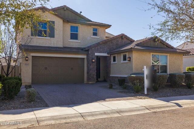 9645 E Theia Dr, Mesa, AZ 85212 - view of front of home featuring stucco siding, a garage, driveway, and a tile roof