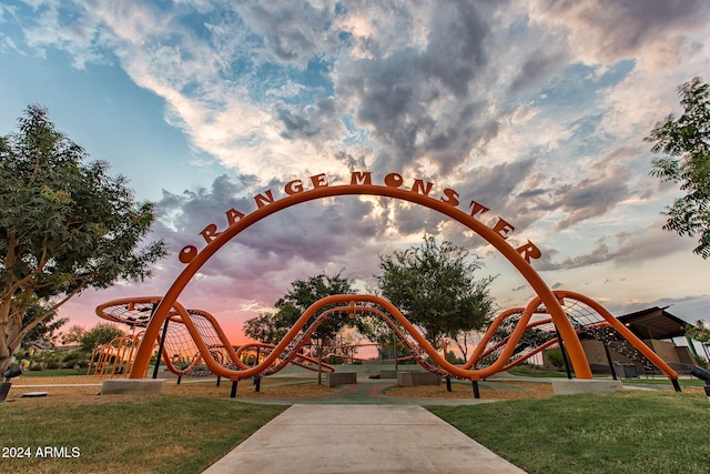 surrounding community with a playground and a lawn