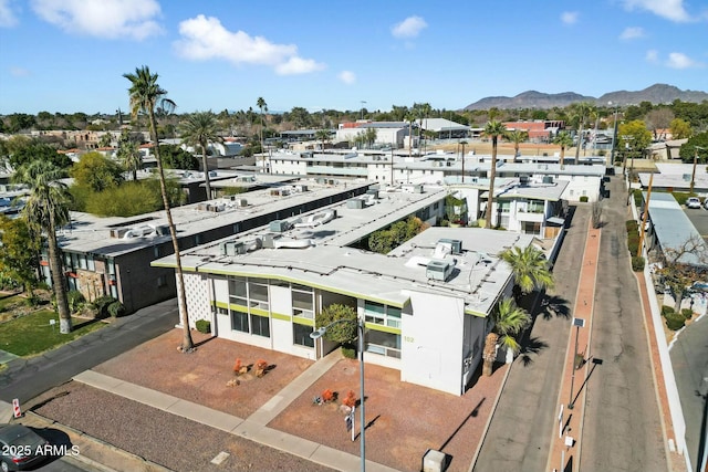 birds eye view of property with a mountain view