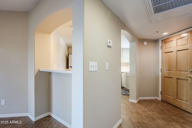 hallway featuring light wood-type flooring