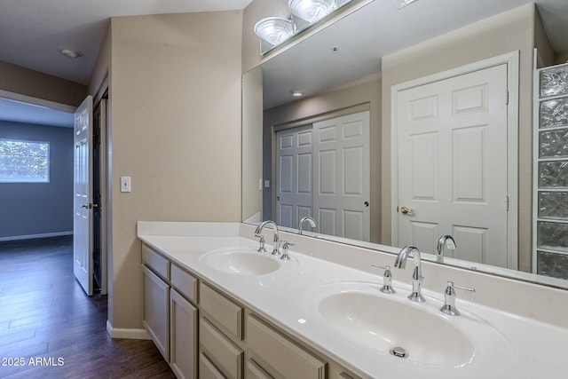 bathroom featuring vanity and wood-type flooring