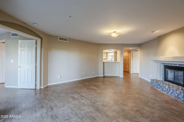 unfurnished living room featuring hardwood / wood-style floors