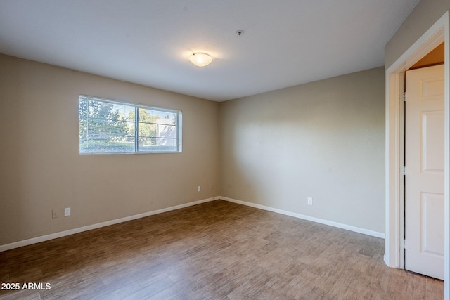 unfurnished room featuring light hardwood / wood-style floors