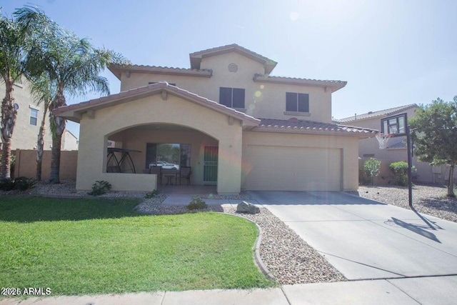 mediterranean / spanish-style house featuring stucco siding, driveway, a tiled roof, and an attached garage