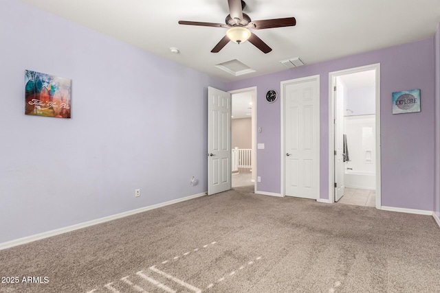 unfurnished bedroom featuring ceiling fan, ensuite bath, and light carpet