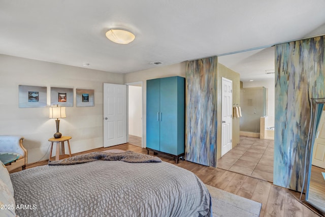 bedroom featuring light wood-style floors