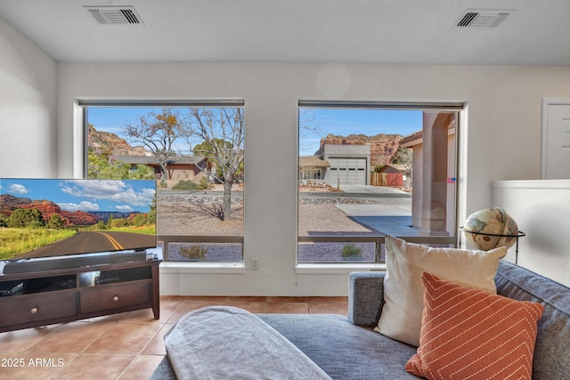 sitting room featuring visible vents and tile patterned flooring