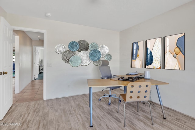 home office with wood finished floors