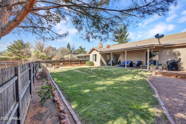 view of yard featuring an outdoor living space, a patio, and a fenced backyard