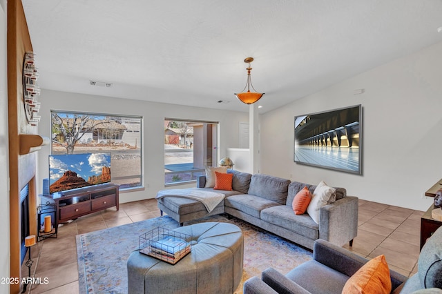 living room with tile patterned flooring and visible vents