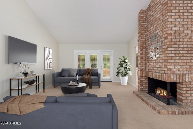 carpeted living room with a fireplace and vaulted ceiling