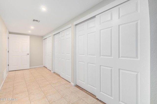 hallway featuring light tile patterned floors