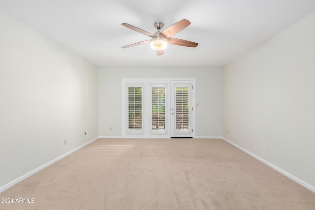 carpeted empty room with ceiling fan