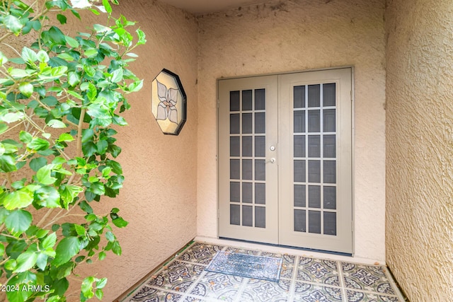 entrance to property featuring french doors