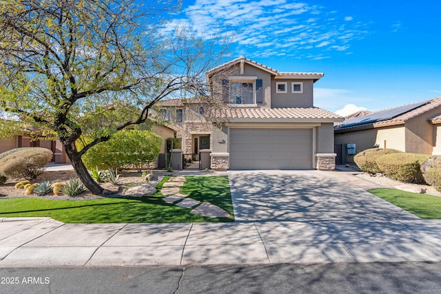 view of front facade with a garage and a front lawn