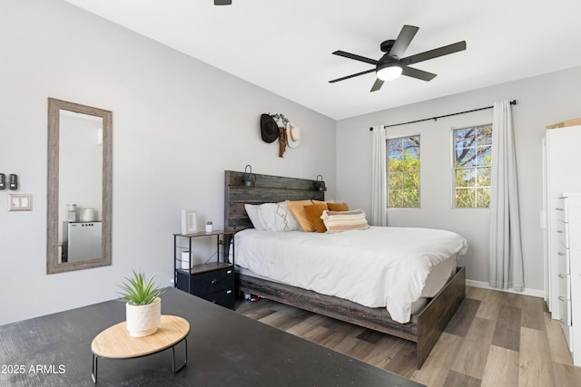 bedroom featuring wood-type flooring and ceiling fan