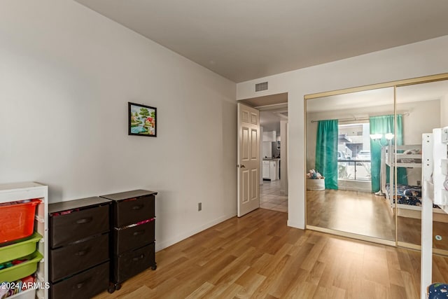 interior space featuring light hardwood / wood-style floors and a closet