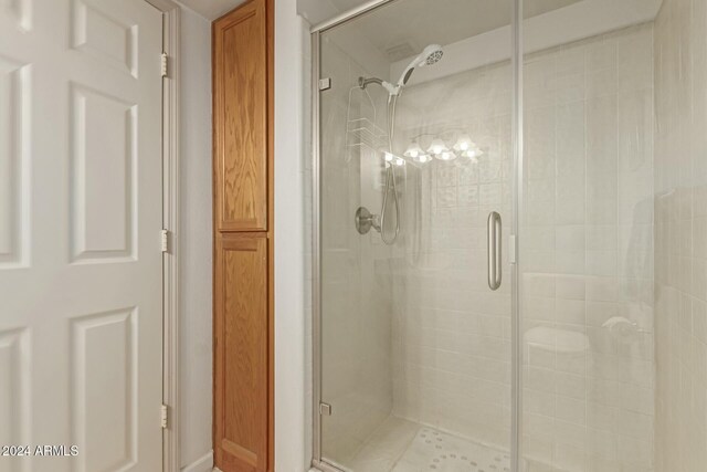 bathroom with an enclosed shower