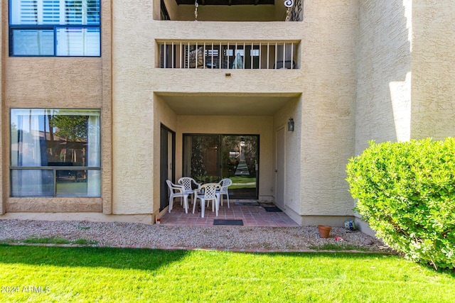 back of house with a patio area