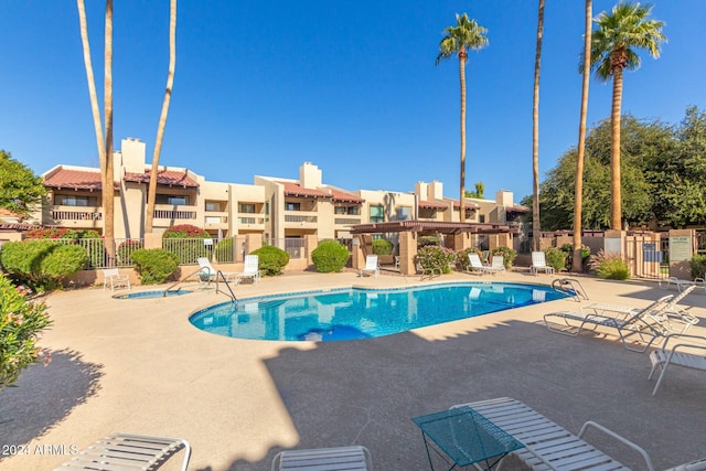 view of swimming pool with a patio area