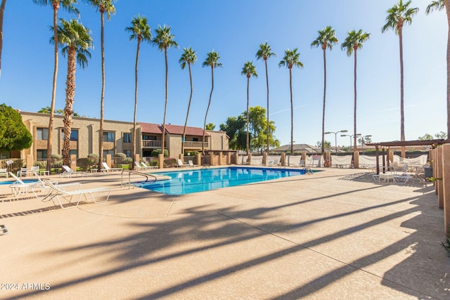 view of swimming pool with a patio area