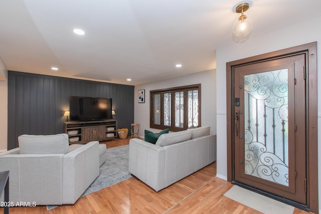 living area featuring light wood finished floors and recessed lighting