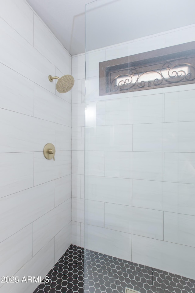 full bathroom with a tile shower