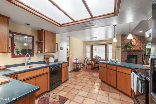 kitchen featuring hanging light fixtures, a brick fireplace, black appliances, brick wall, and sink