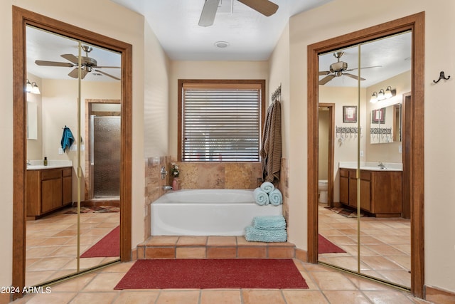 bathroom with ceiling fan, toilet, vanity, and tile flooring