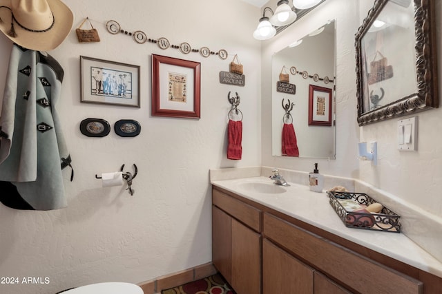 bathroom featuring vanity with extensive cabinet space