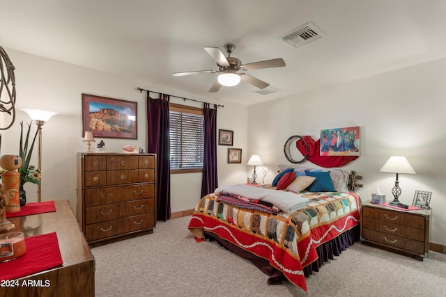 bedroom with light carpet and ceiling fan