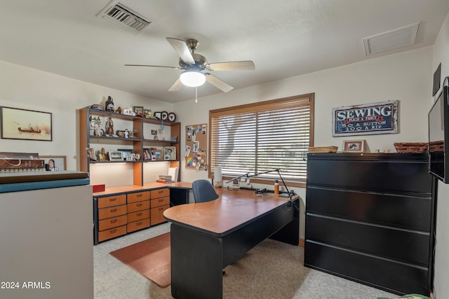 office with light carpet and ceiling fan