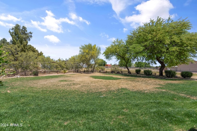 view of yard with a rural view