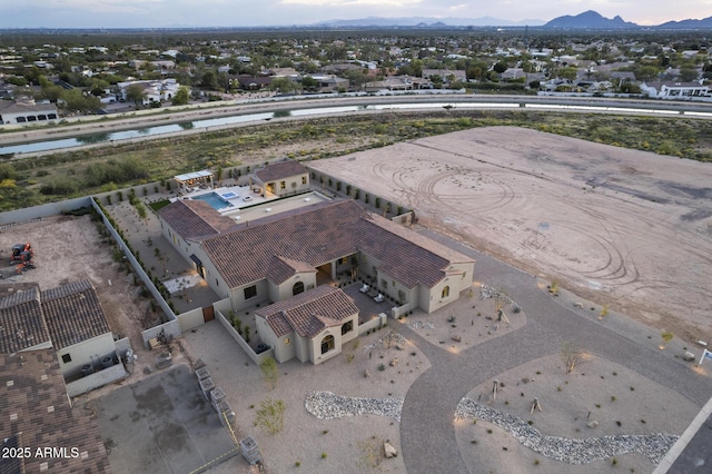 birds eye view of property with a mountain view