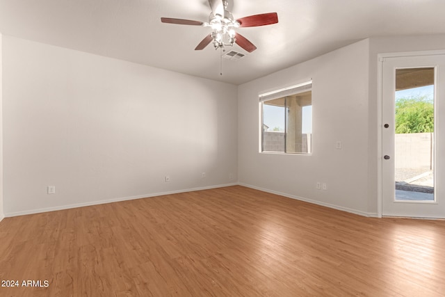 spare room featuring ceiling fan and light wood-type flooring