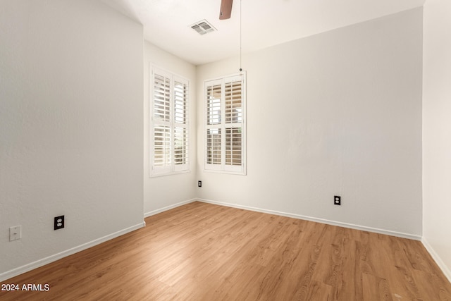 spare room with light hardwood / wood-style floors