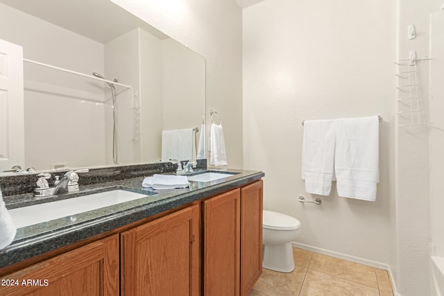 full bathroom with shower / bathing tub combination, vanity, tile patterned flooring, and toilet