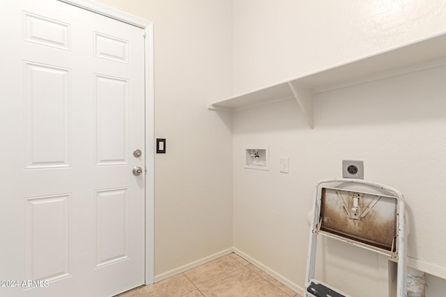 laundry area with washer hookup, electric dryer hookup, and light tile patterned floors