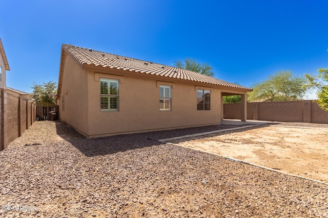 rear view of house with a patio