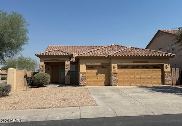 mediterranean / spanish-style house featuring a garage