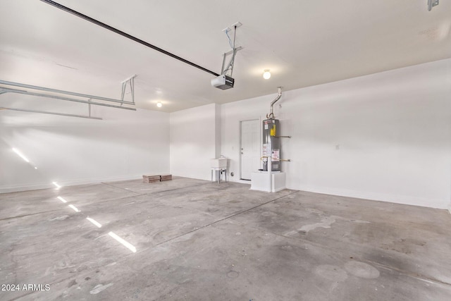 garage with water heater and a garage door opener