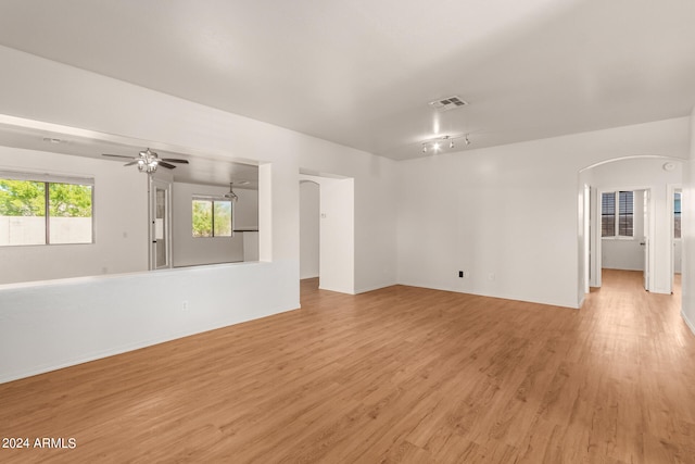 spare room with light hardwood / wood-style floors and ceiling fan