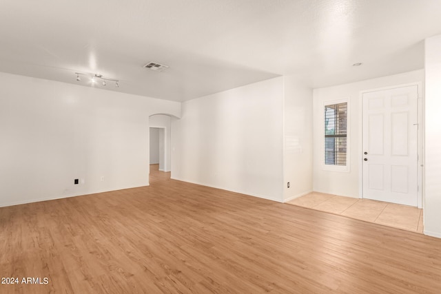 unfurnished room with light hardwood / wood-style flooring