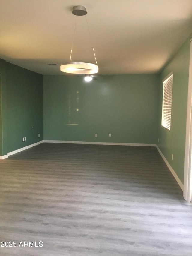 4722 S 238th Ln, Buckeye, AZ 85326 - empty room featuring wood finished floors and baseboards